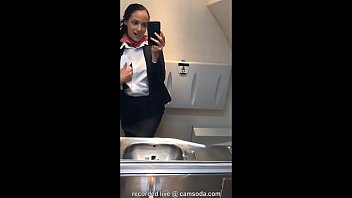 Mulatto in a stewardess uniform shows candid erotica