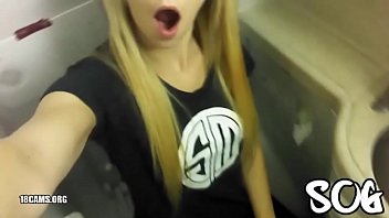In the airplane lavatory unsatisfied skinny girl pecks her own pussy with her fingers