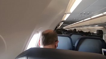 A flight attendant hand-fucked a business class passenger's phallus