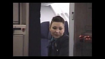 With his long dick the pilot fucks the stewardess' raw throat in the cabin